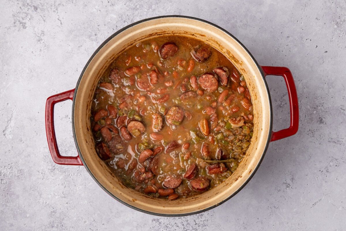 dutch oven with beans partially broken down after continued cooking