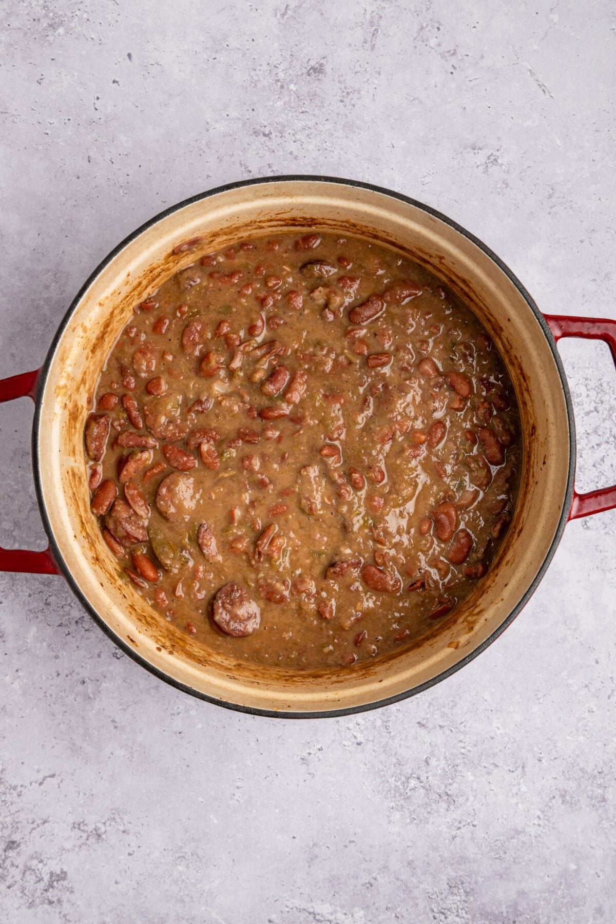 Dutch oven with bacon, hot sauce, and cider vinegar added