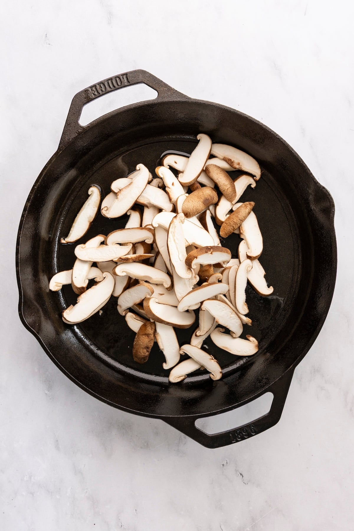 Mushrooms in cast iron skillet.