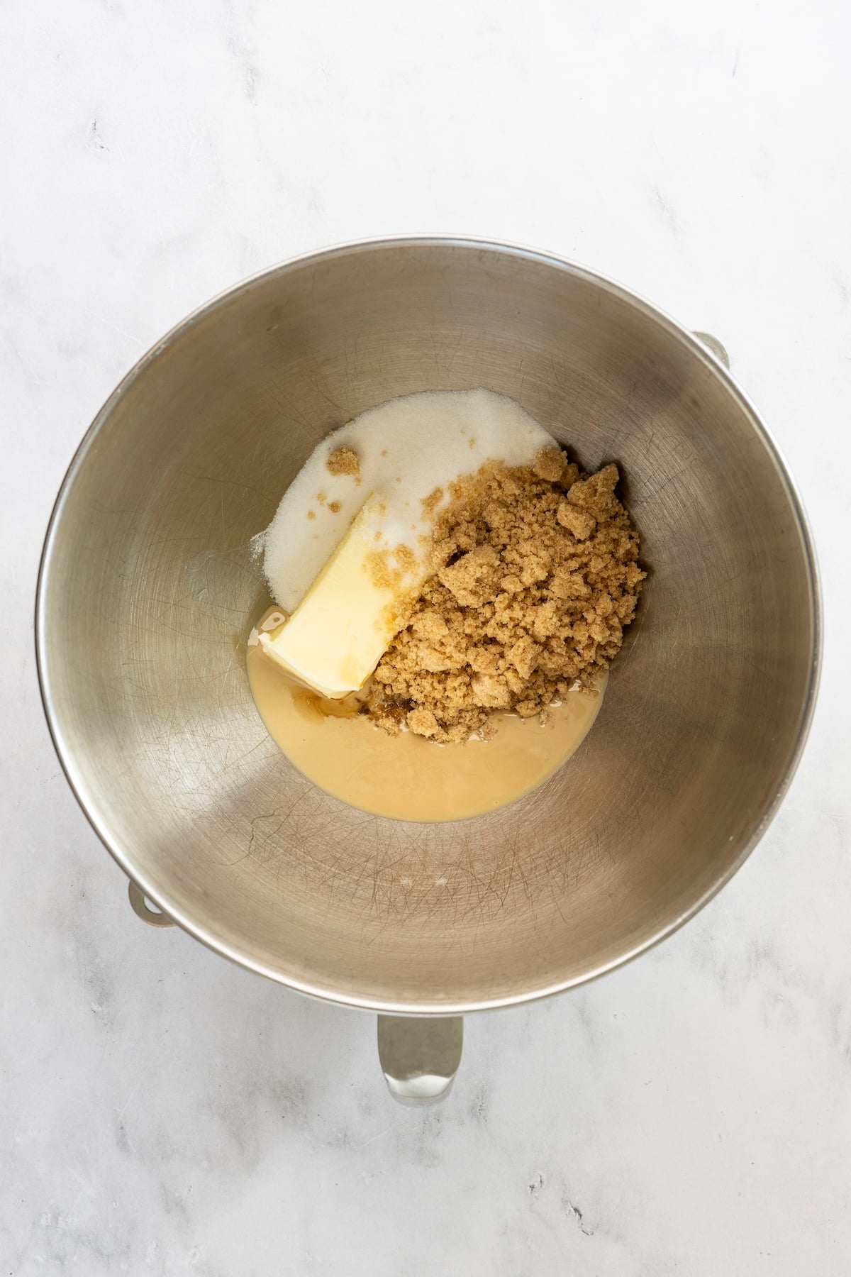 mixing bowl with butter, tahini, sesame oil, granulated sugar, and brown sugar