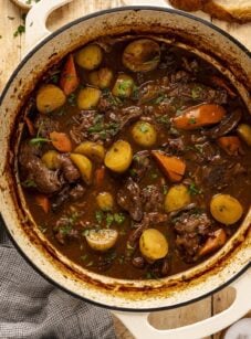 Beef stew with vegetables in Dutch oven.