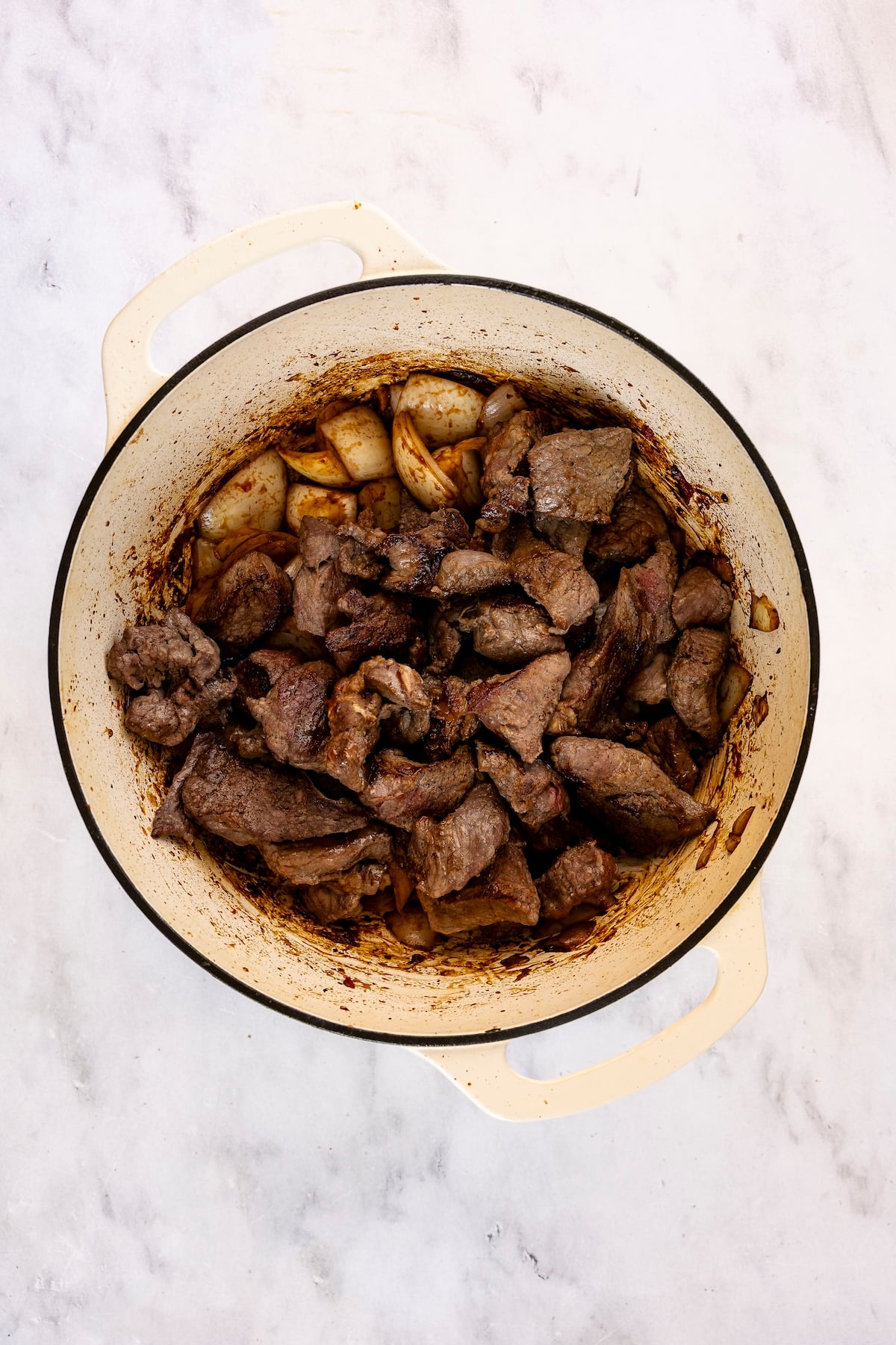 Seared beef added back to the pot.