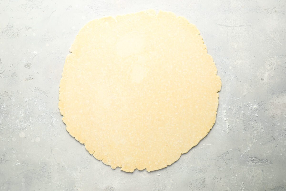 Pie crust rolled out on counter.