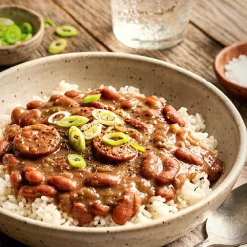 Red beans and rice on wooden table.