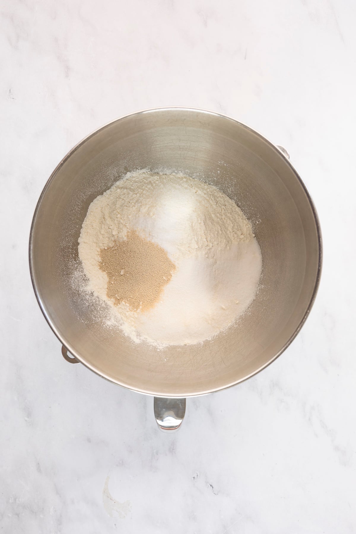 mixing bowl with flour, salt, sugar, and yeast